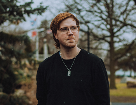 Addi John standing looking off in Windsor On..